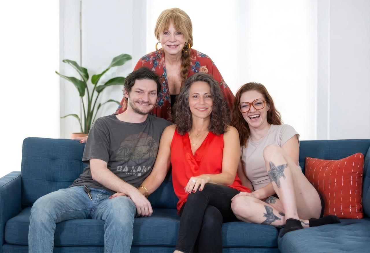 Group of young adults together on the beach at sunset